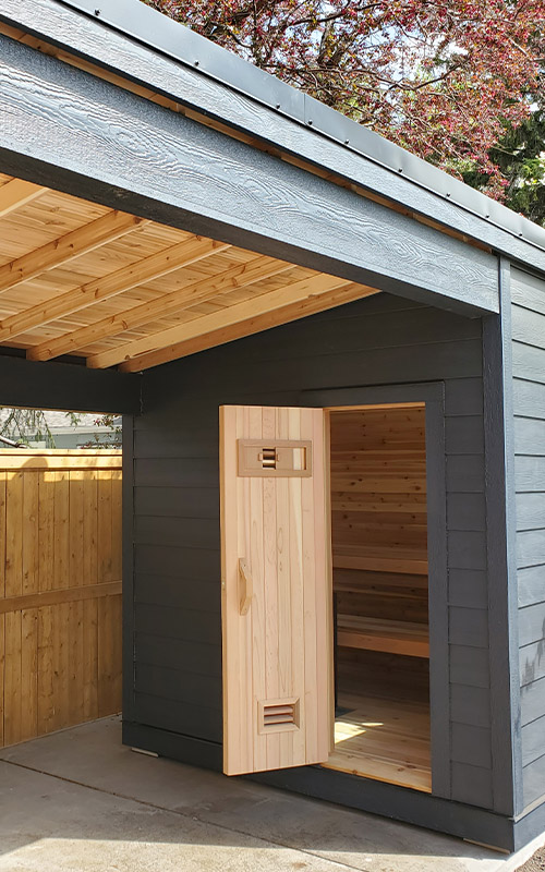 Outdoor Sauna with covered patio by Sauna Builder